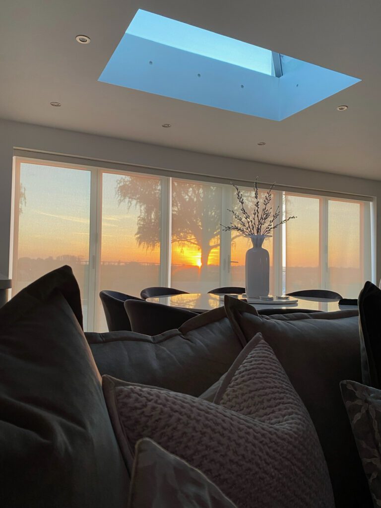 Sunset through privacy roller blinds